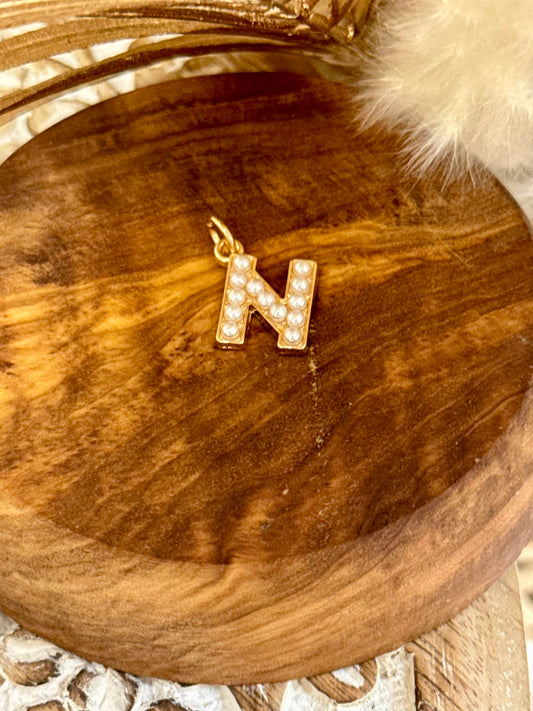 charm initial - N